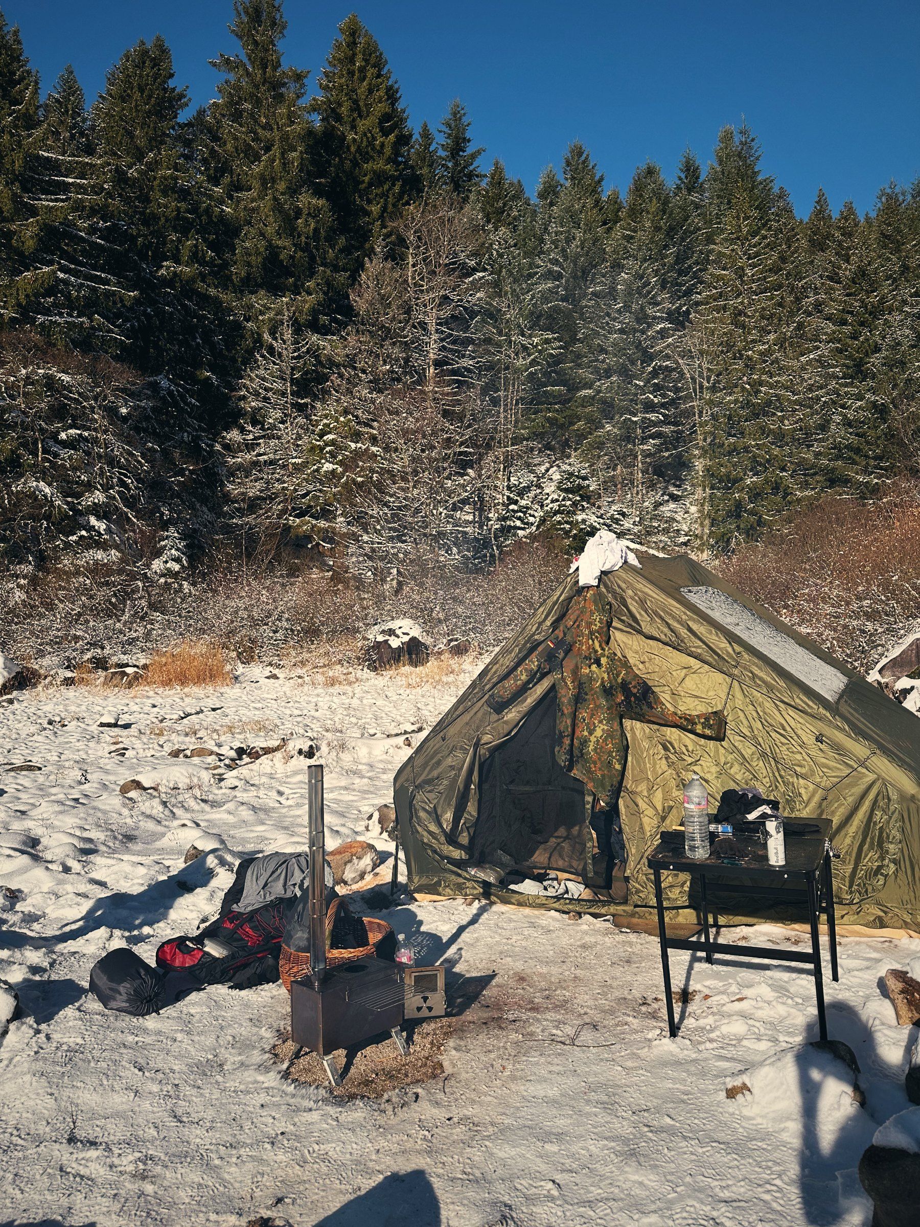 Tent with stove in the snow at Lac Blanc