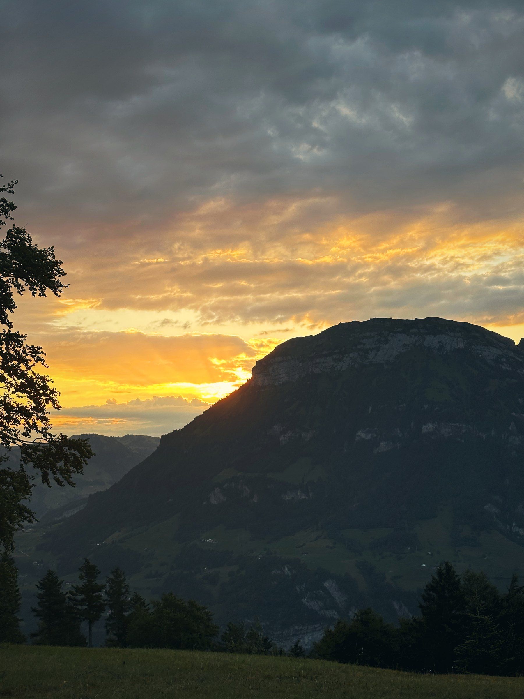Sunset behind a mountain