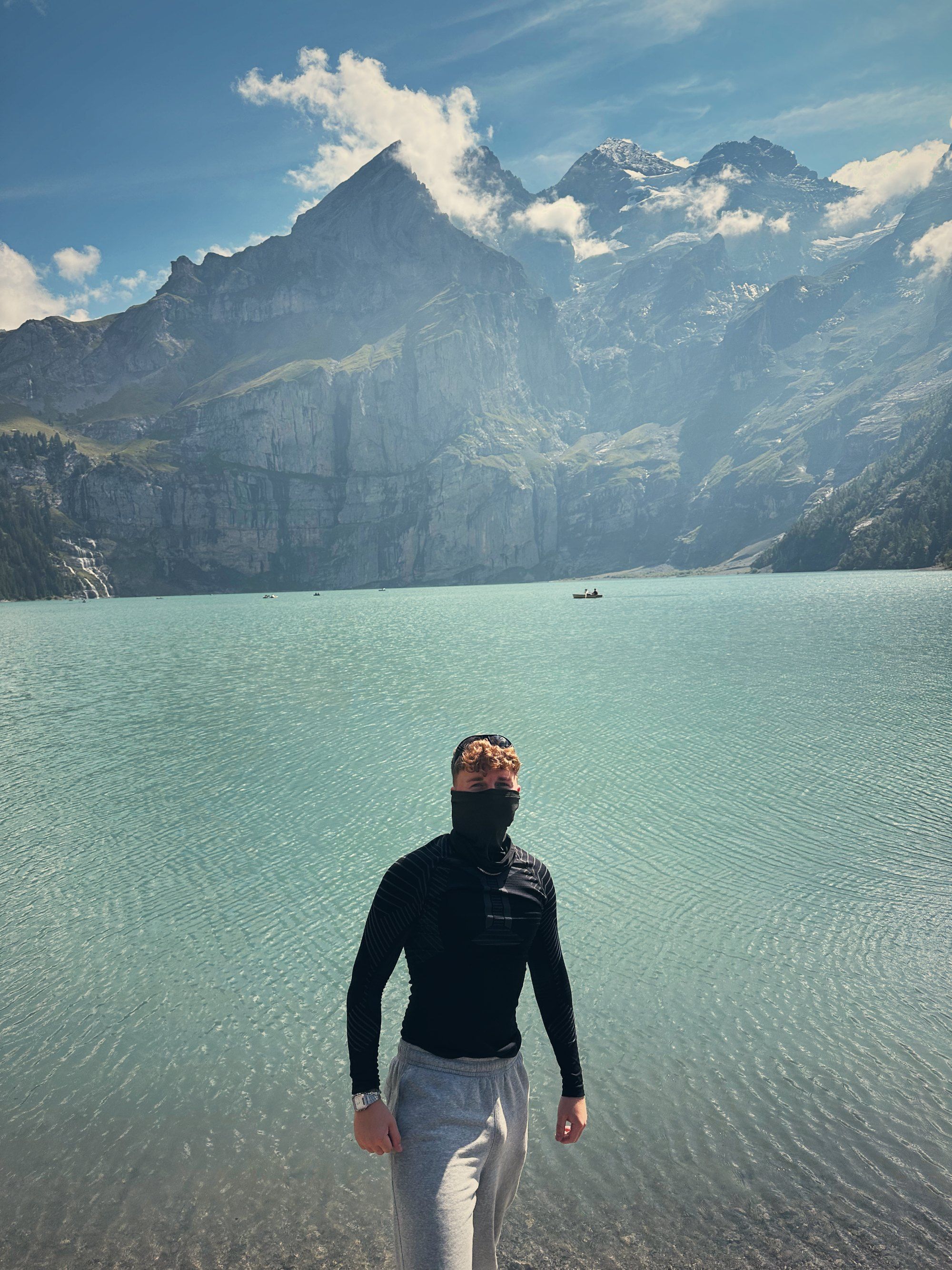 Tea in a face mask on the shore of Lake Oeschinen